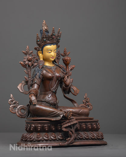 Side view of oxidized Green Tara sculpture showing intricate craftsmanship