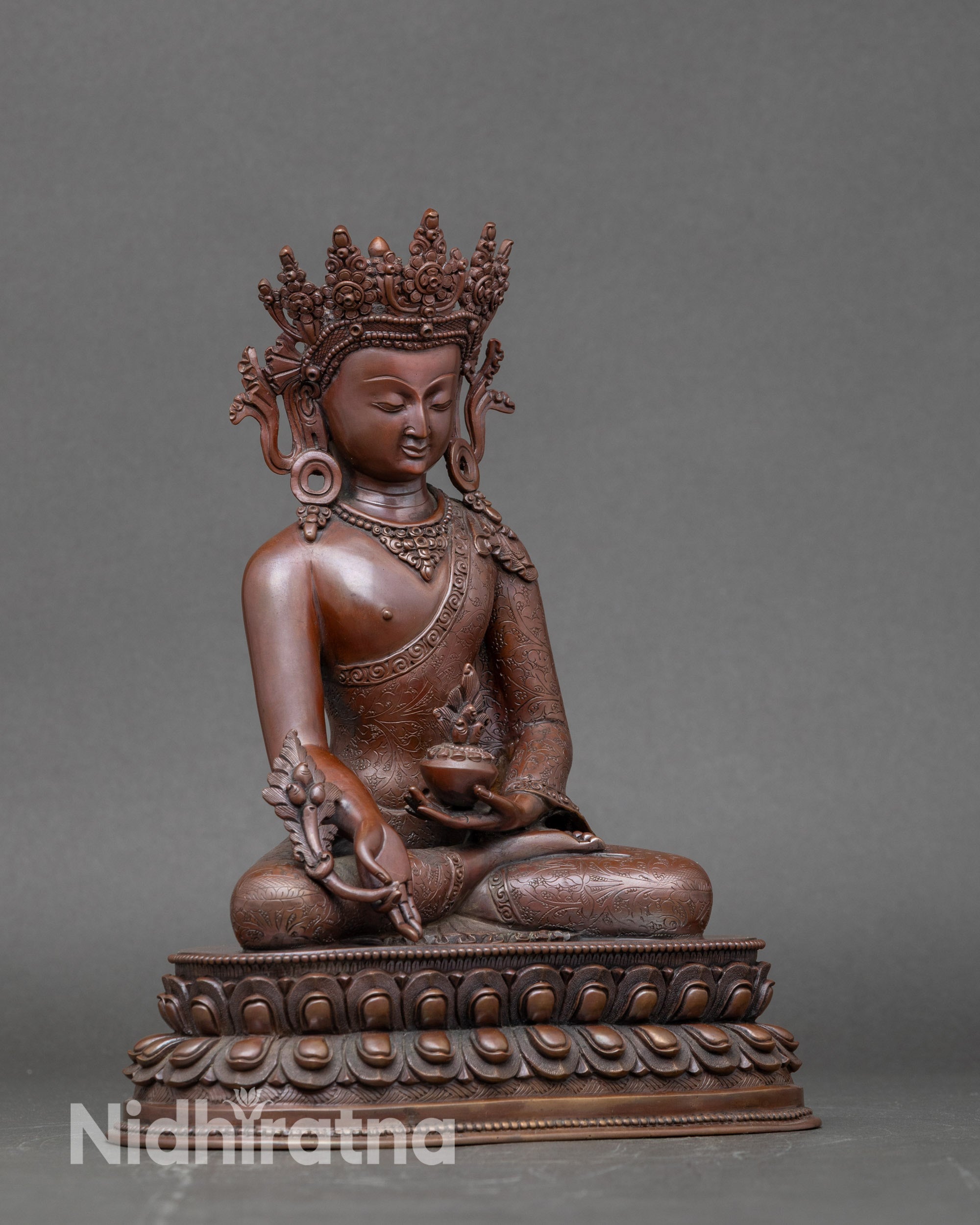 Side view of oxidized Medicine Buddha meditation statue, handmade Nepal copper sculpture for spiritual decor