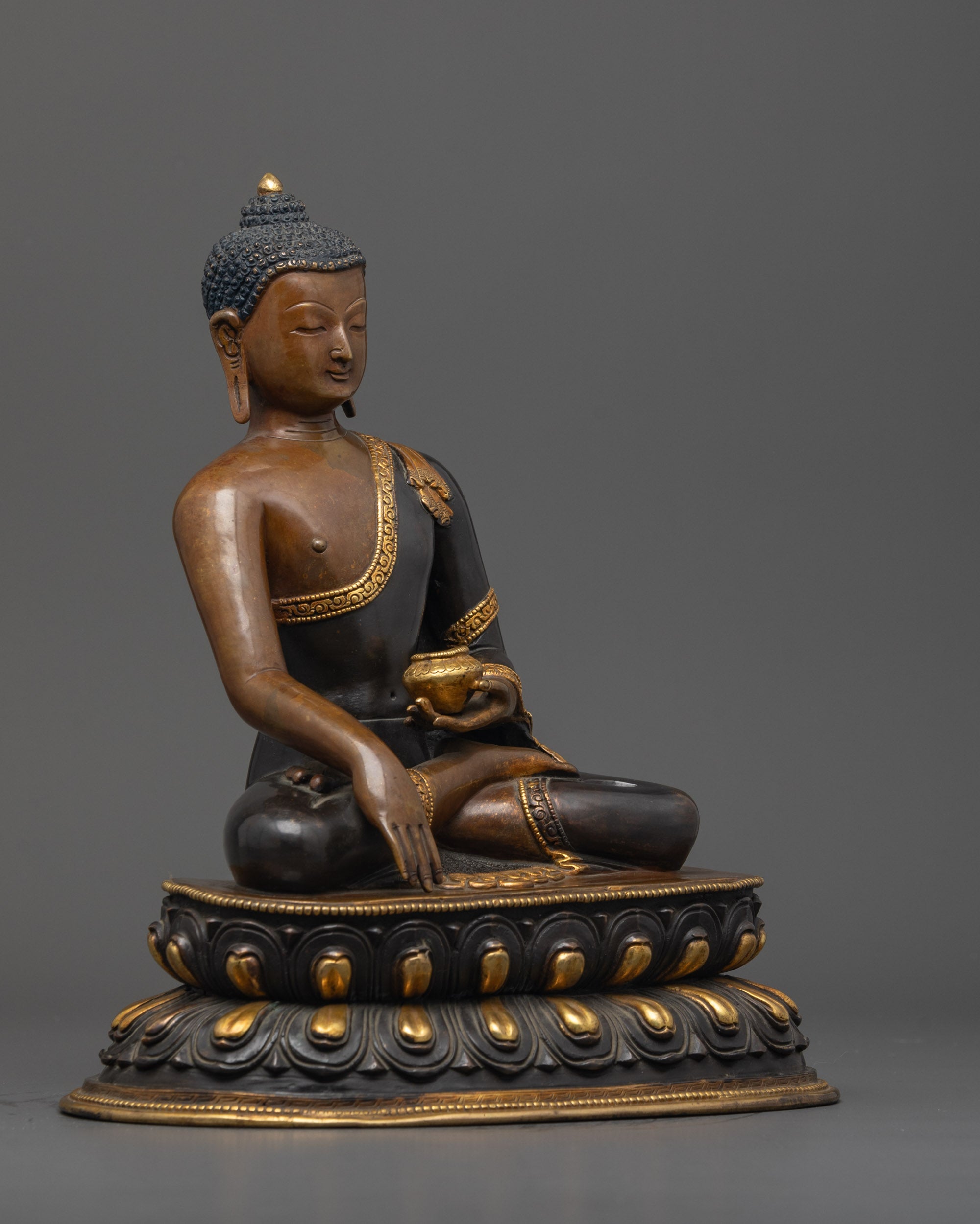 Side view of oxidized copper Shakyamuni Buddha Statue seated in earth-touching mudra