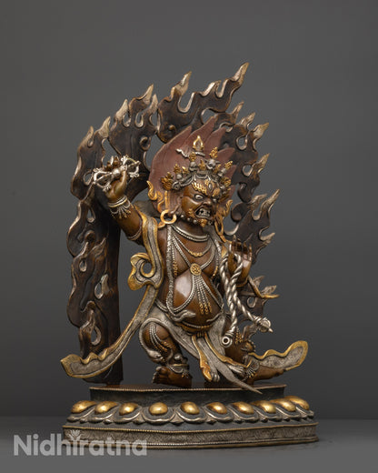 Side view of oxidized copper Vajrapani with tiger skin and patterned garments