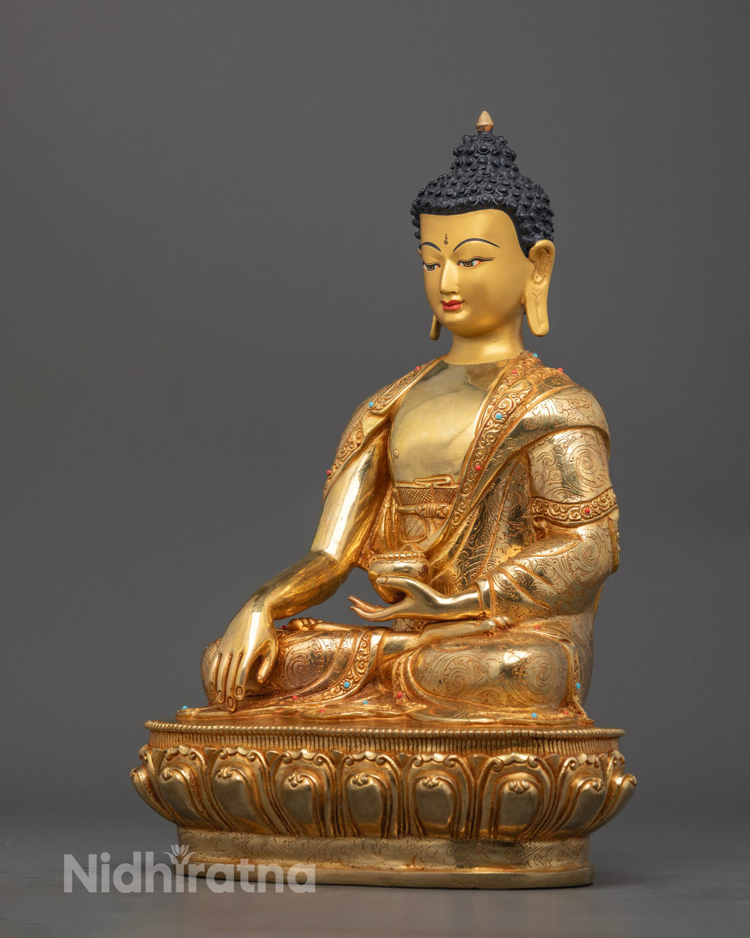 premium Shakyamuni Buddha Statue made from fire-gilded copper, featuring vibrant acrylic colors and intricate lotus base design.
