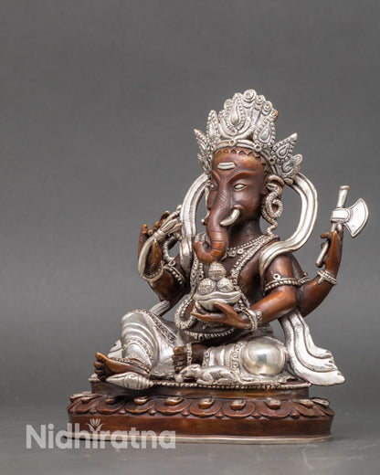 Side view of silver-plated Ganesh figurine for meditation, home altar, or sacred space