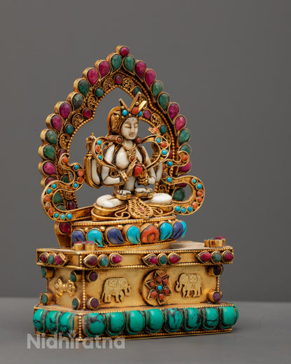 Stone Chenrezig sculpture highlighting the consecration chamber and spiritual symbolism.