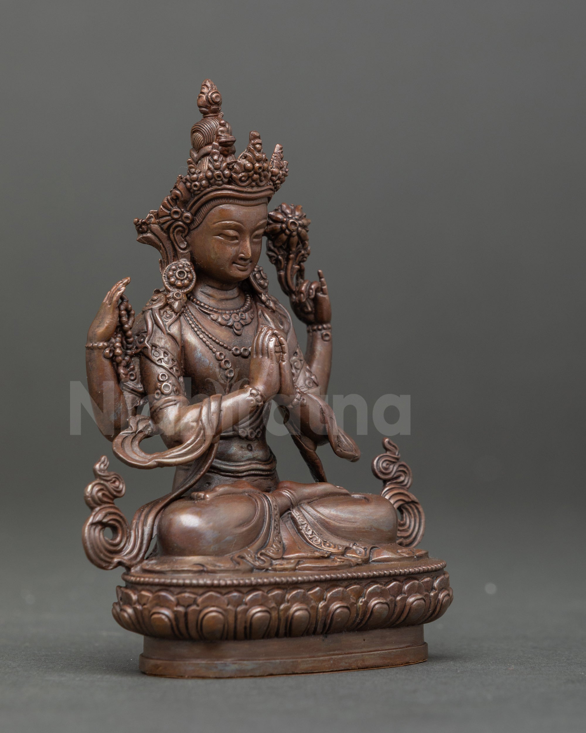 Side view of the Himalayan Avalokiteshvara sculpture in brownish oxidized finish