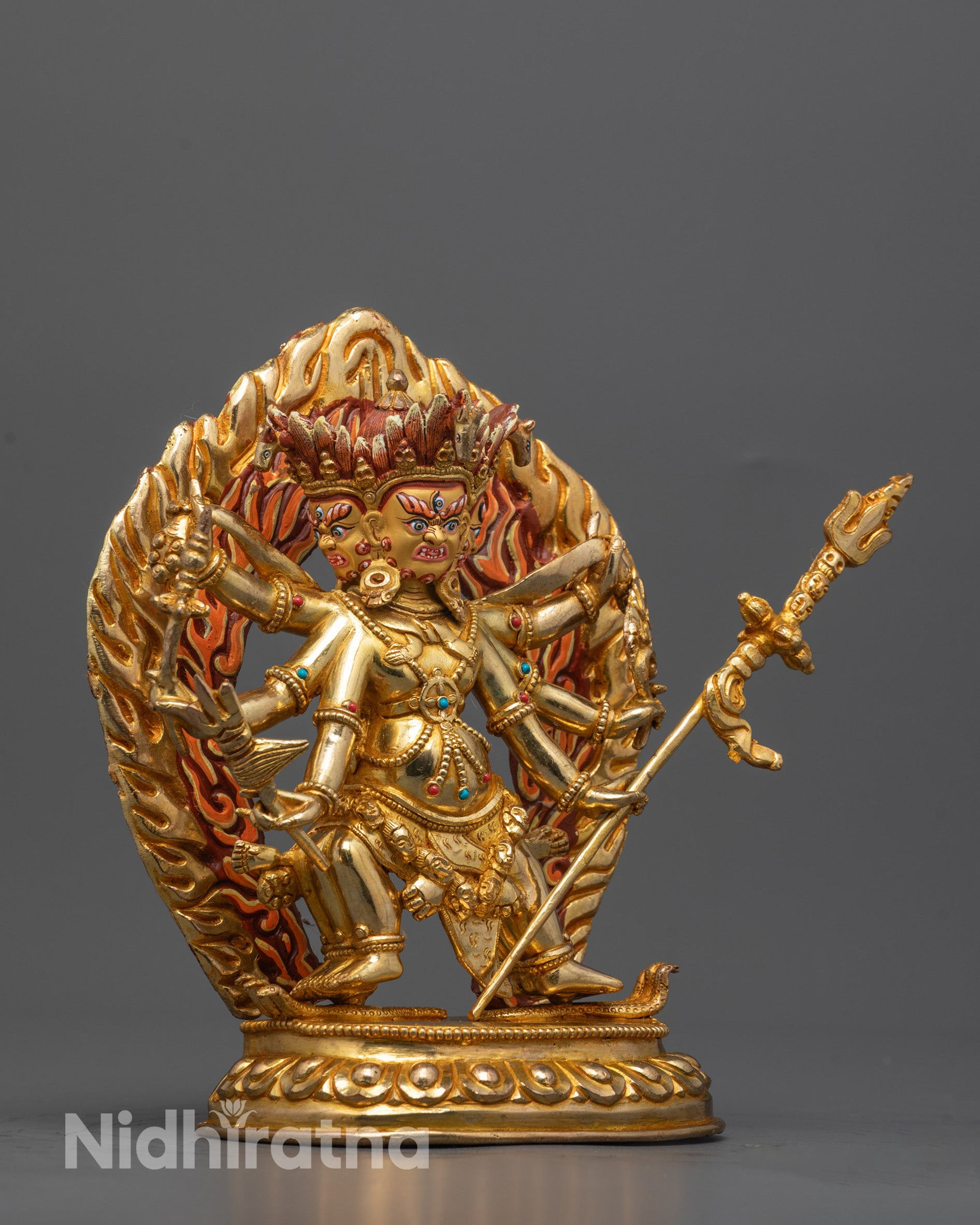 Side view of traditional Nepalese Dharmapala Statue seated on a lotus base