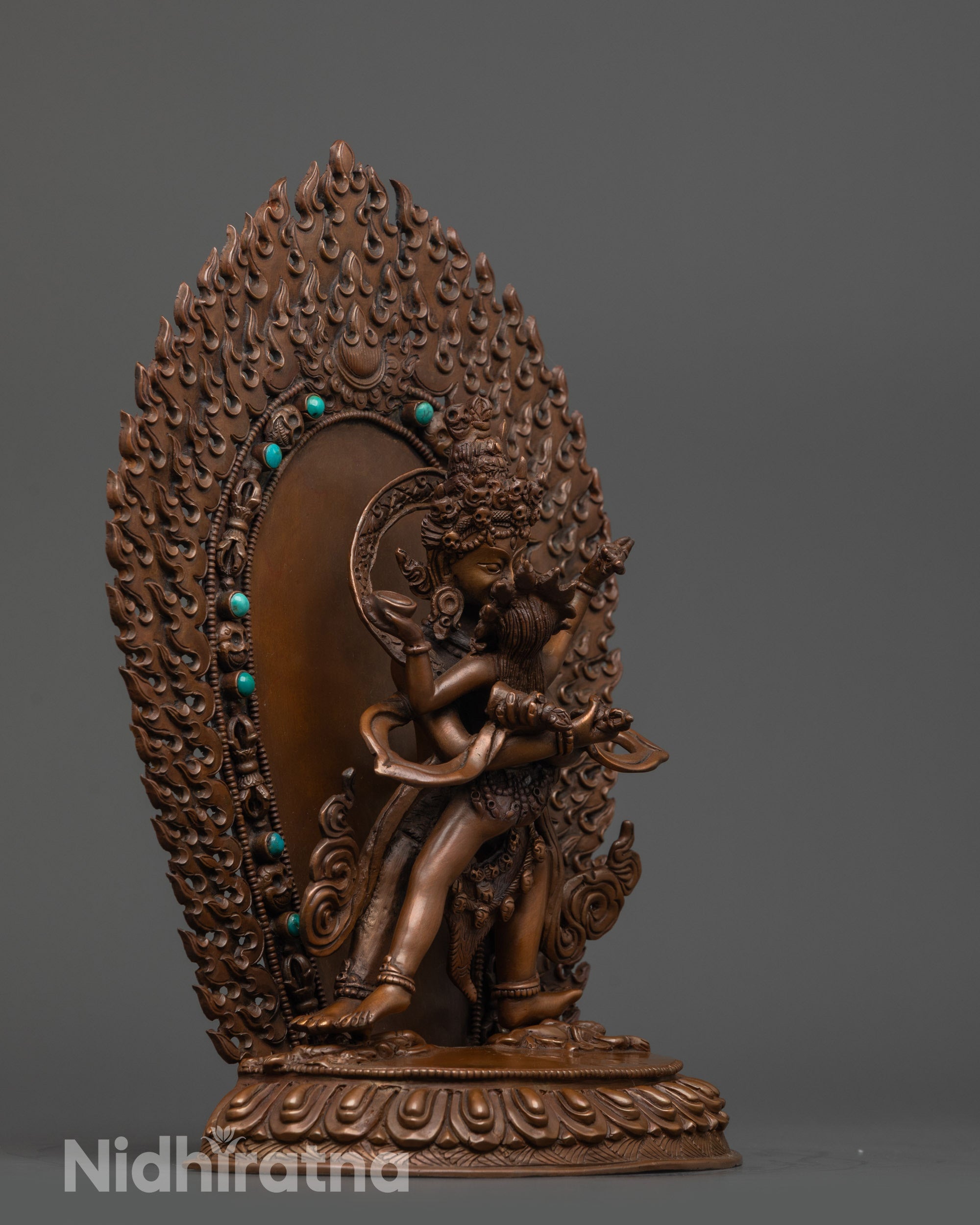 Side view of wrathful Chakrasamvara with Vajravarahi and detailed vajra symbol