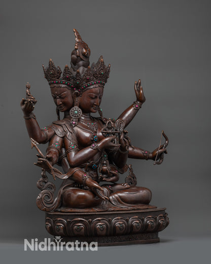 Side view oxidized Namgyalma deity with flowing robes and earthly copper hue
