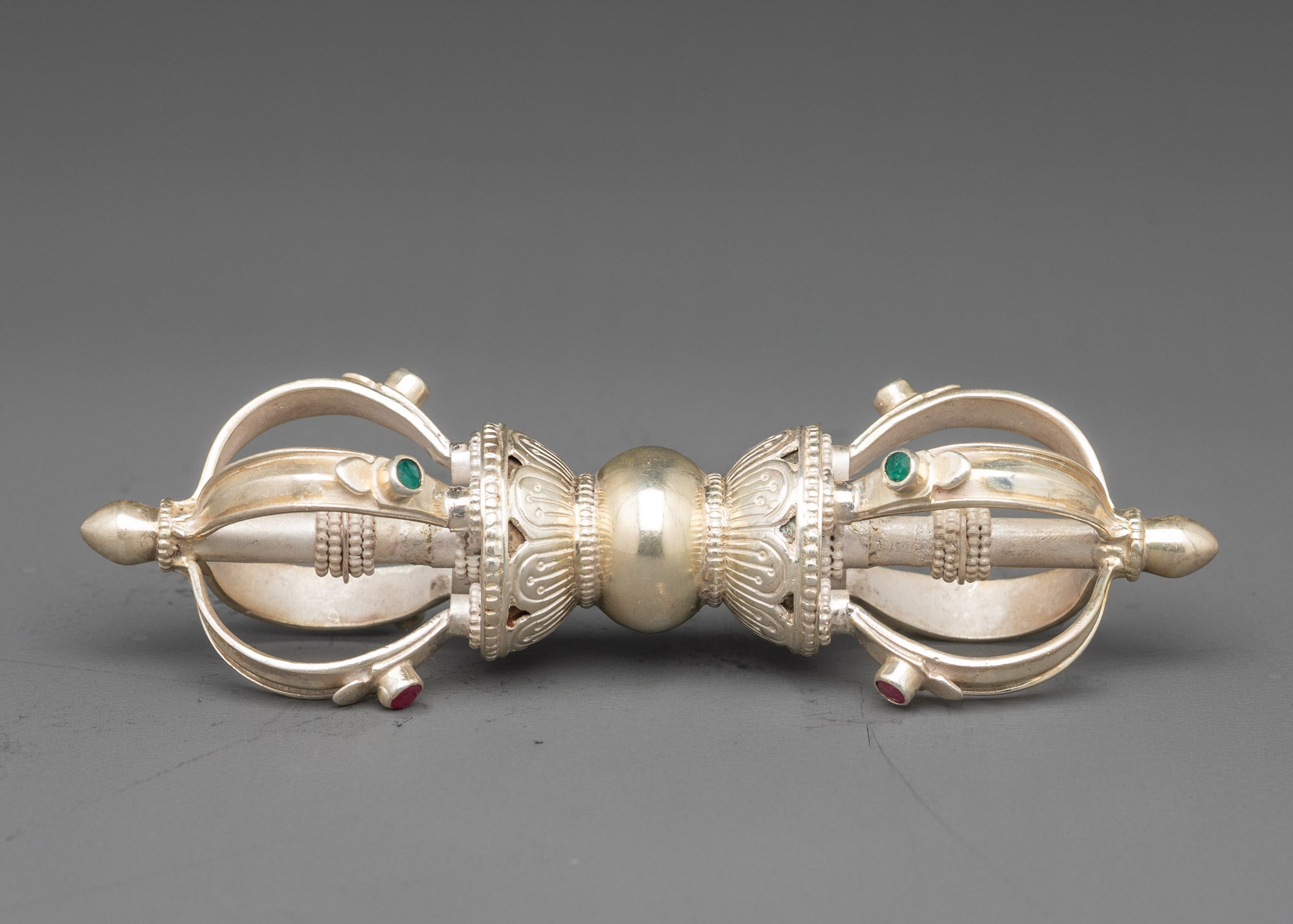 Side view pure silver vajra | Intricate patterns symbolizing strength and spiritual power