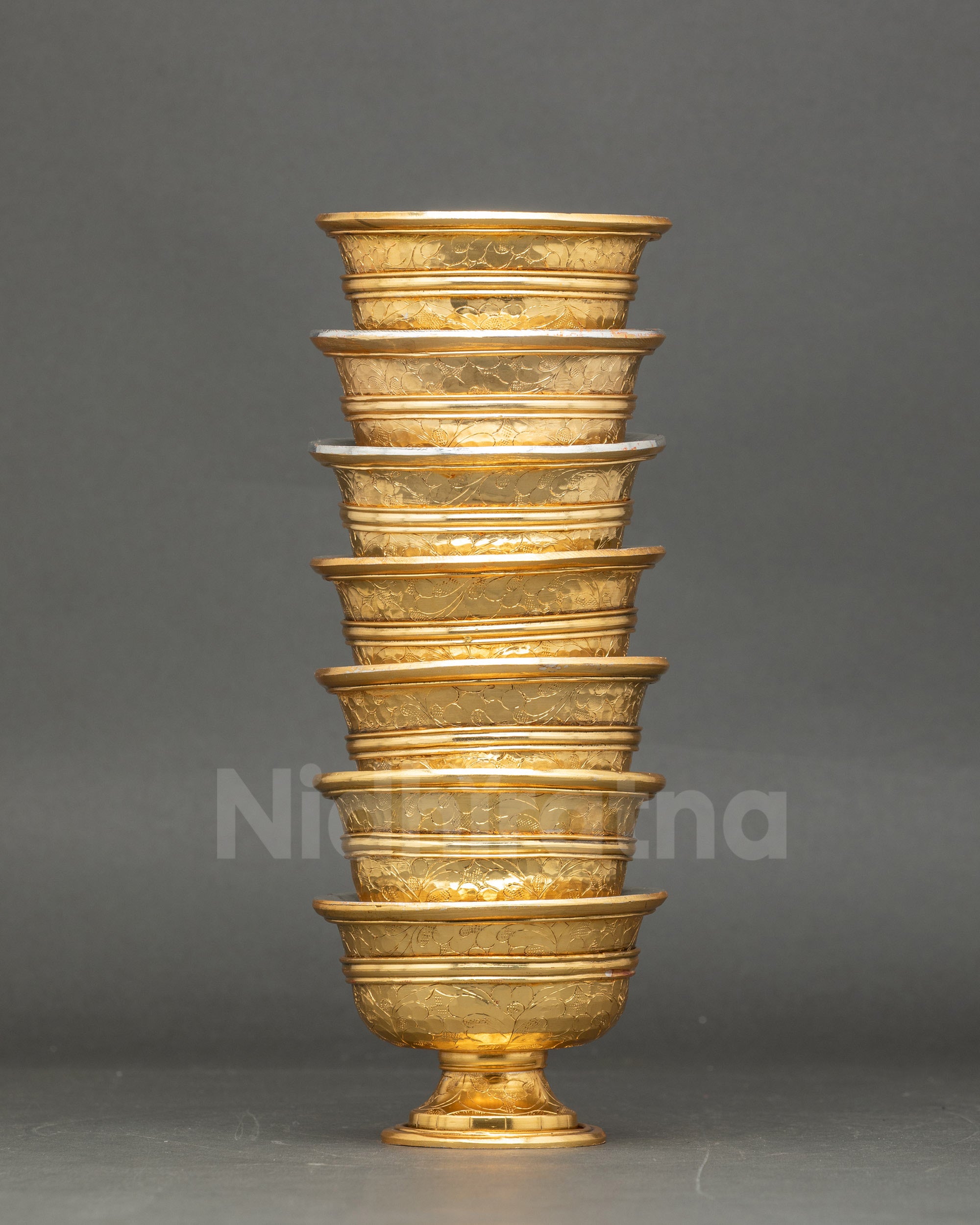 Side view seven bowl water offering set for Tibetan Buddhist rituals and daily puja