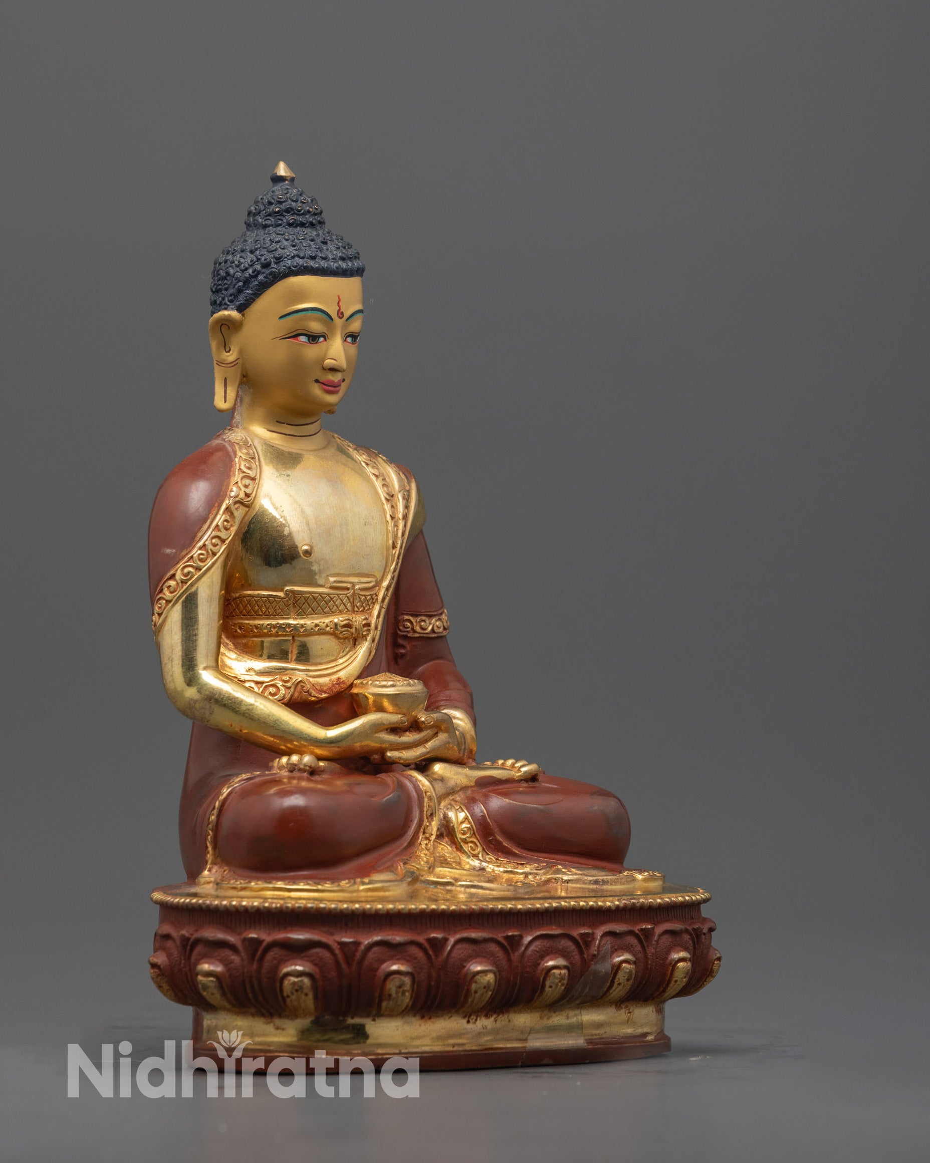 Side view showing partially gold fire-gilded copper body and carved robe of Amitabha Buddha
