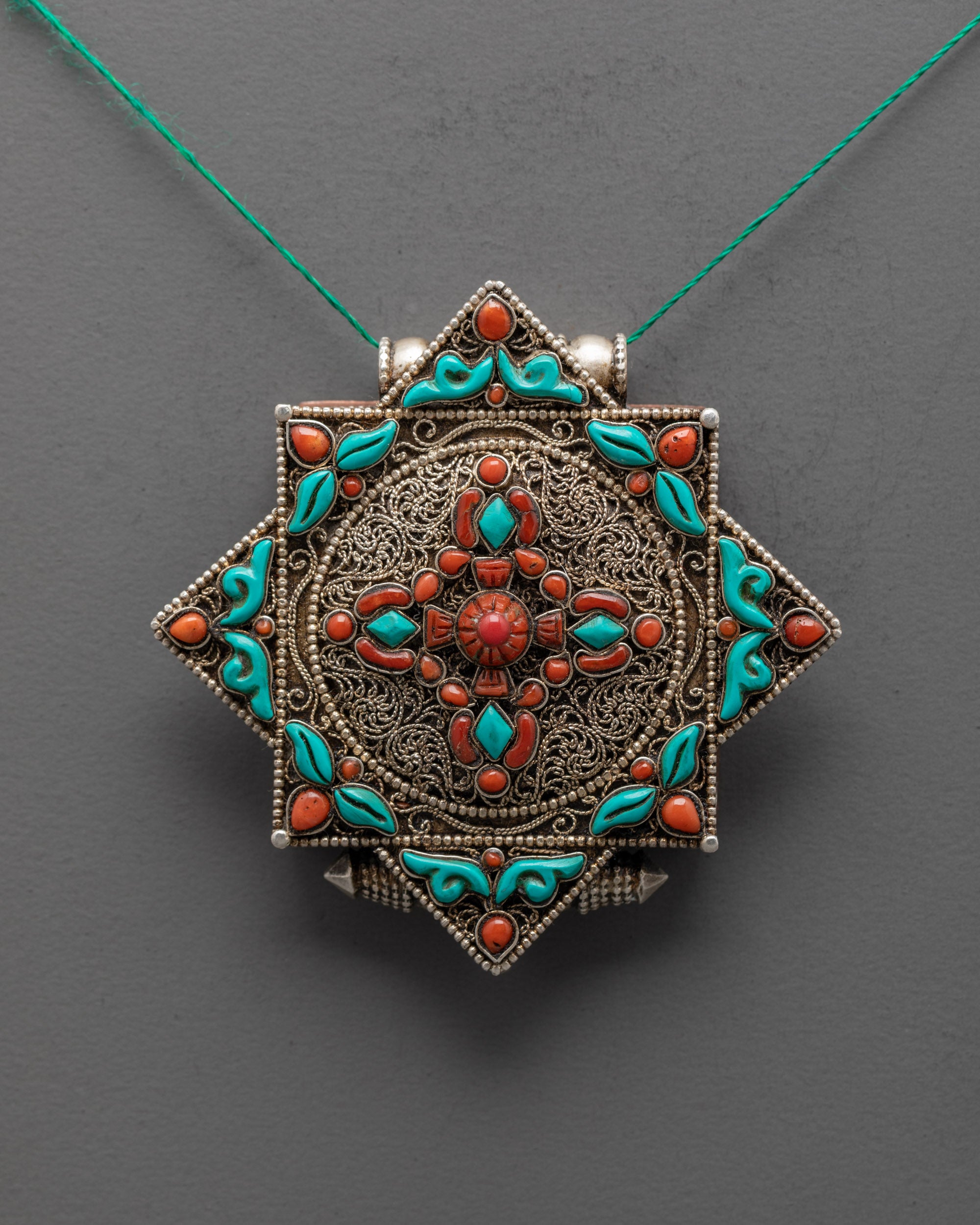 Silver Bishwo Vajra Locket displayed on a necklace chain, ideal for meditation