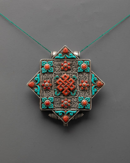 Silver Endless Knot Locket Necklace with coral and turquoise stones, handcrafted filigree design