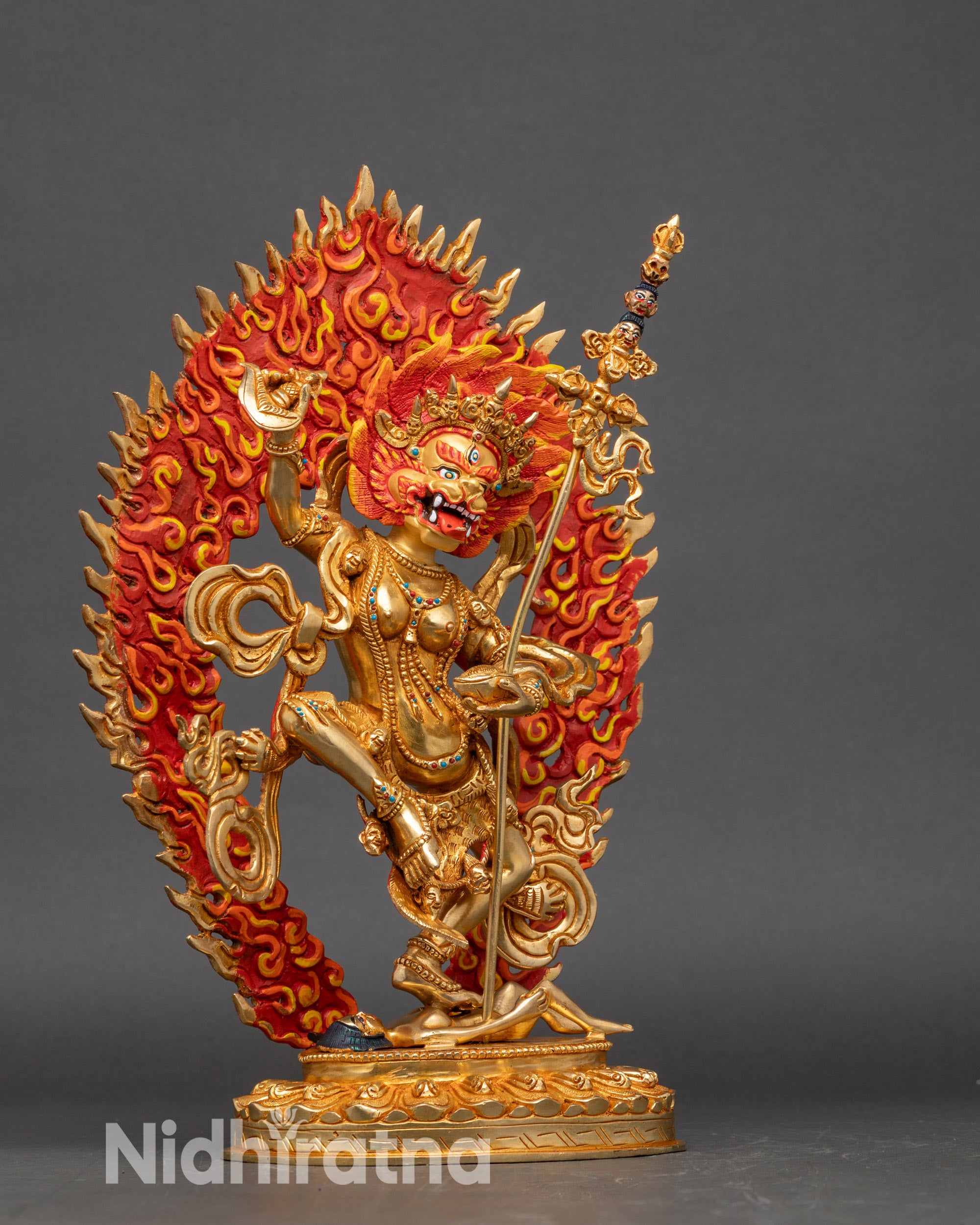 Simha Mukha sculpture holding kartaika knife and skull cup, with khatvanga staff and lotus seat