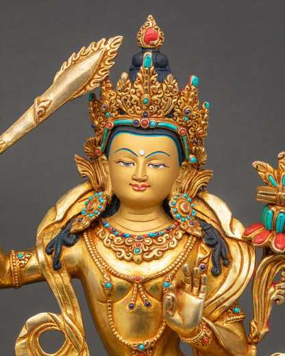 Simhanada Manjushri close up copper and gold fire-gilded Buddha sculpture