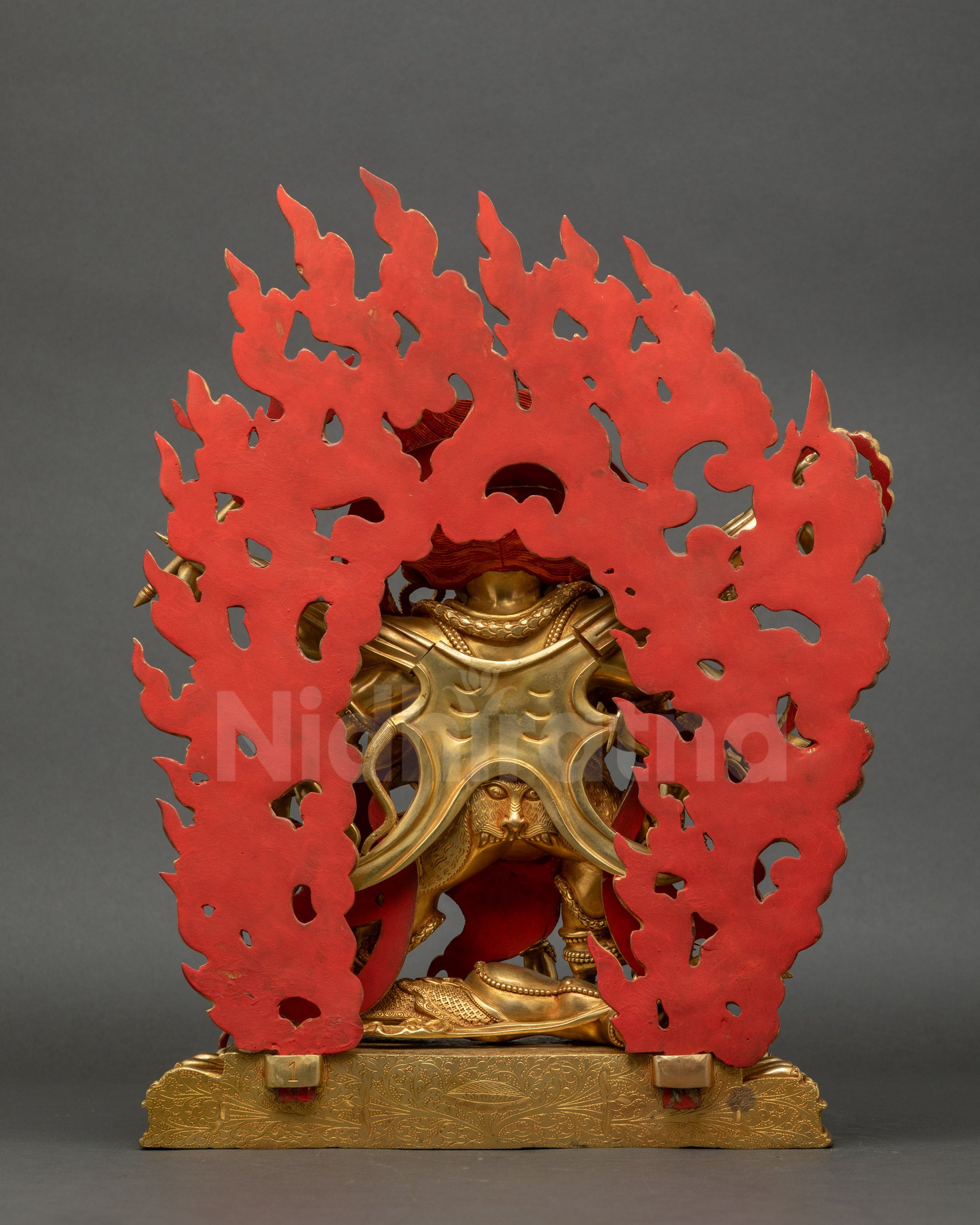 Back view of Six-Armed Mahakala statue showing detailed halo, intricate robes, and tiger-skin pattern