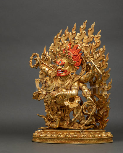 Left side view of Mahakala statue with six arms, tiger-skin garments, skull garland
