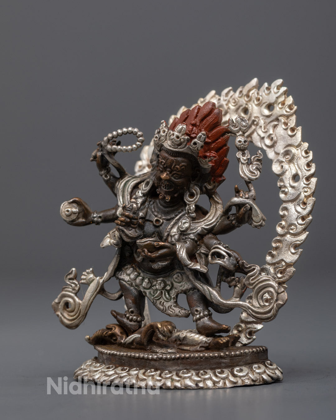 Six-Armed Mahakala holding vajra-handled curved knife and blood-filled skull cup on lotus throne