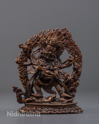 Six-Armed Oxidized Mahakala statue in copper with fierce expression and radiant halo