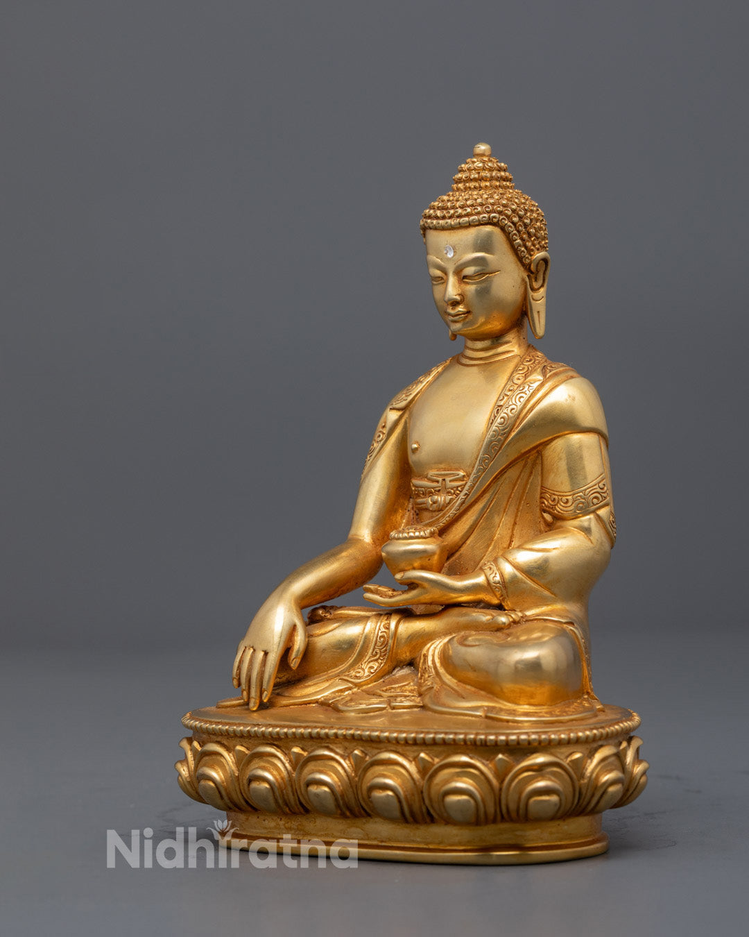 Spiritual Meditating Buddha Shakyamuni statue symbolizing enlightenment and mindful presence with gold gilding and intricate traditional details