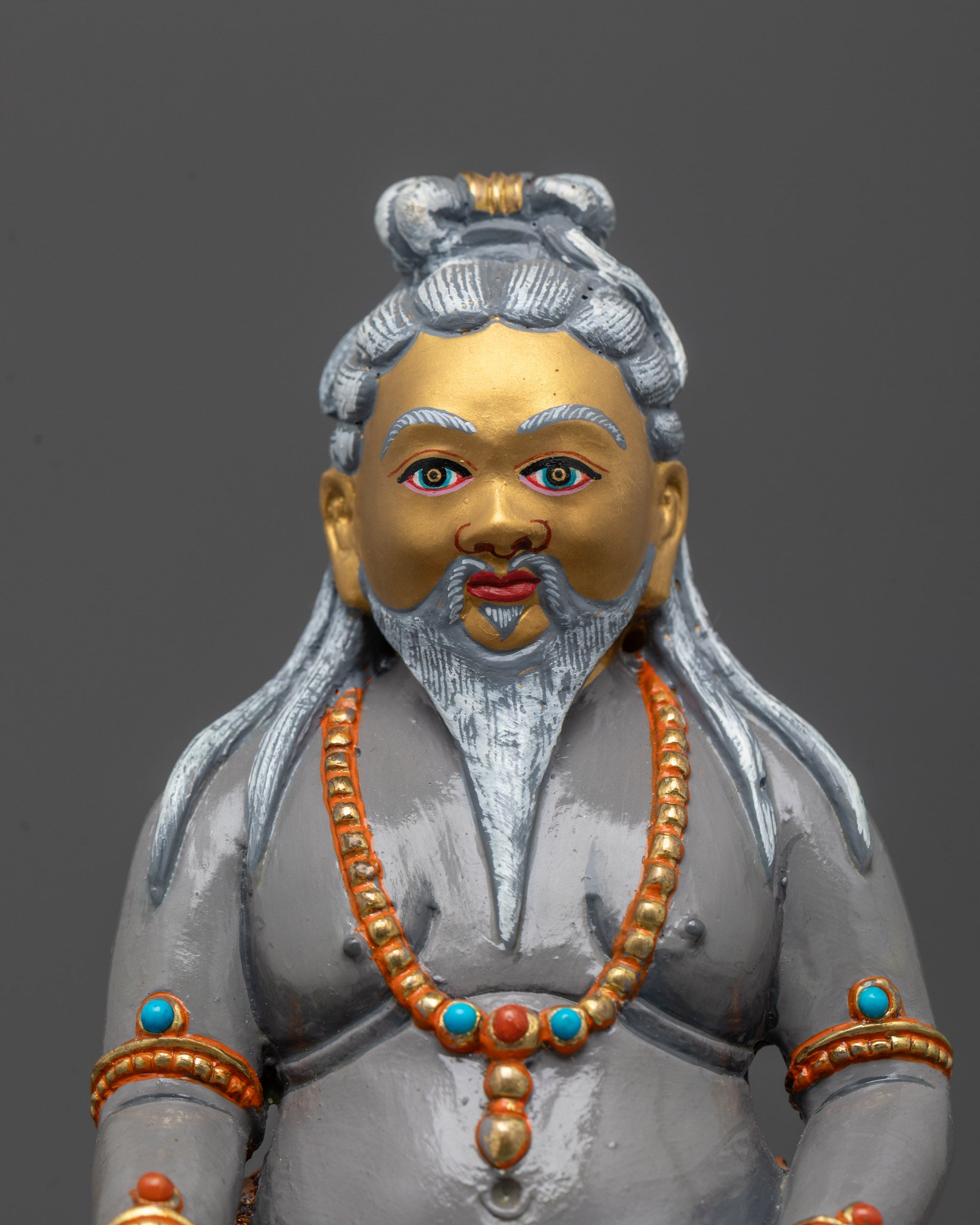 Close-Up of Thangtong Gyalpo Statue Face with Serene Expression