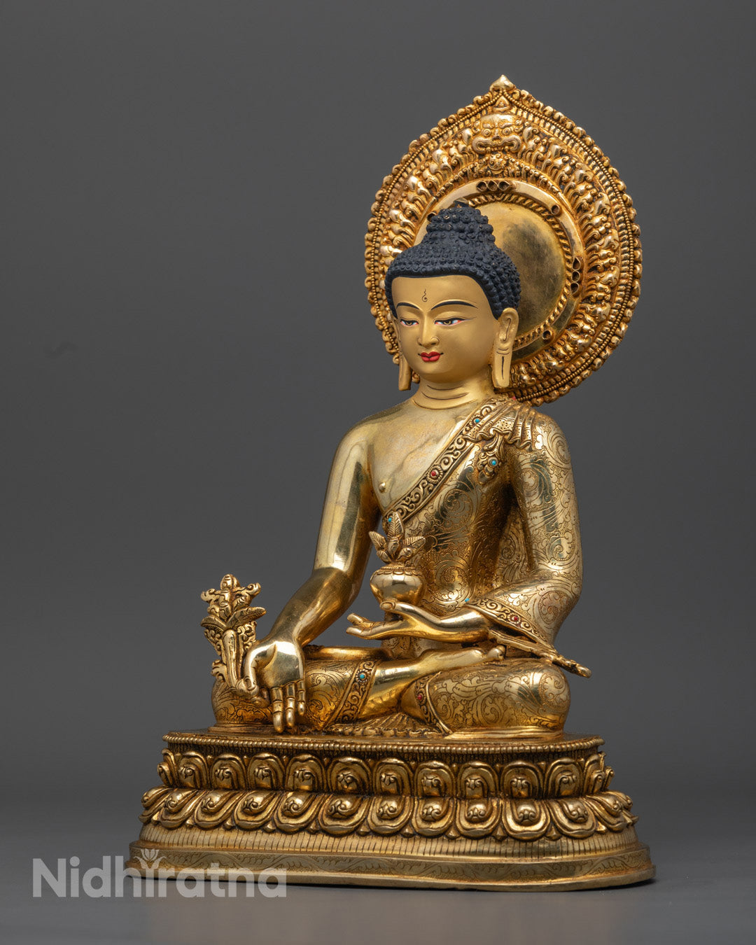 The 24K gold gilded Medicine Buddha statue, designed for filling with mantras, sacred scrolls, and consecrated substances for enhanced spiritual potency