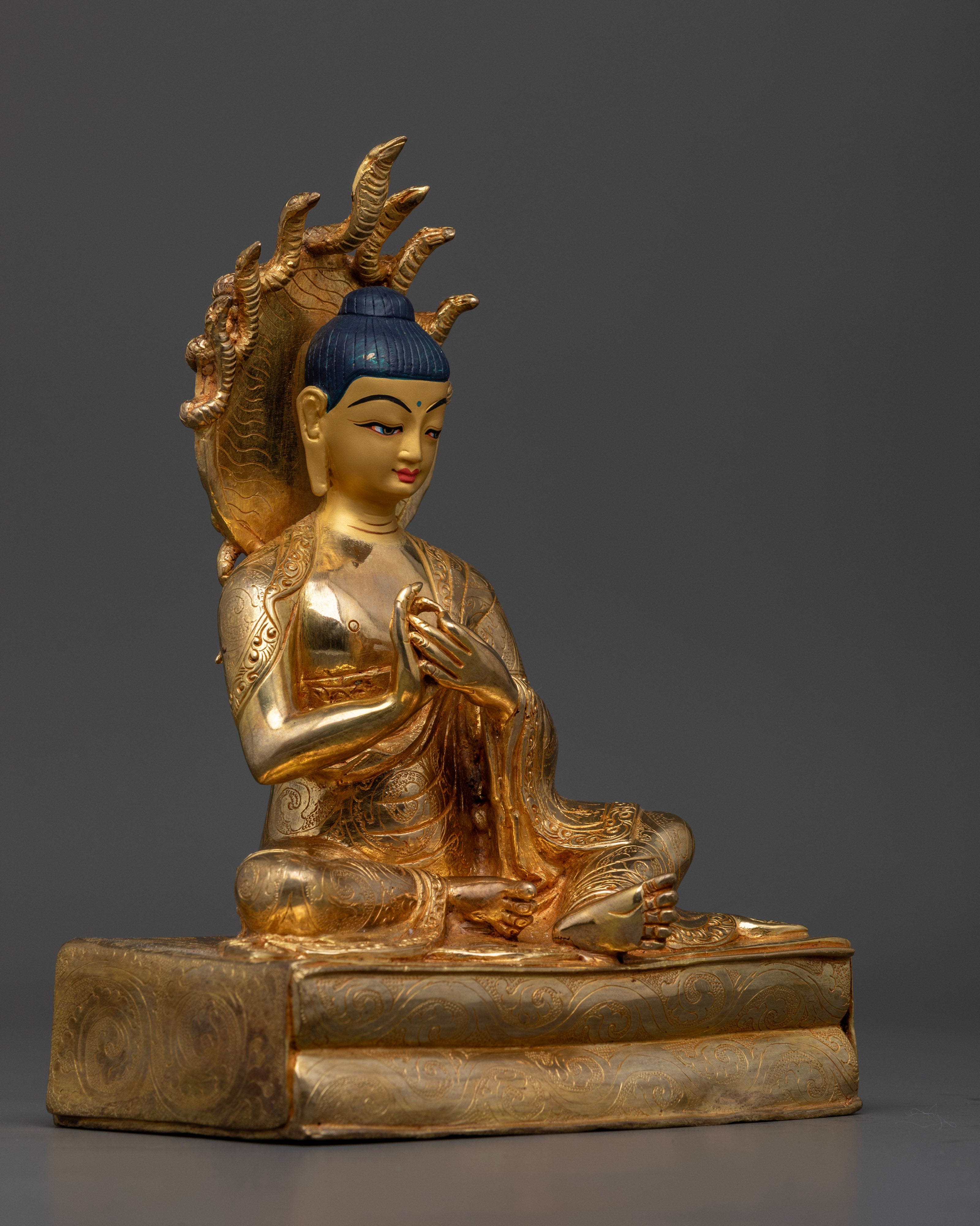 The 24cm tall Nagarjuna statue, showcasing intricate craftsmanship, colorful embellishments, and the symbolic beauty of traditional design.