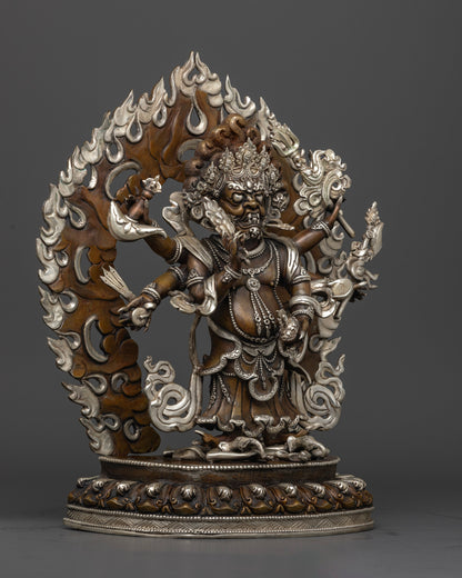 The 4.64kg White Mahakala statue, highlighting intricate carvings, vibrant paintwork, and the statue’s elegant silver finish.