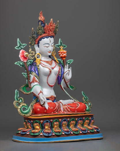 The 8.09kg White Tara statue, revealing fine ornamentation, flowing robes, and delicate embellishments painted in vibrant hues.