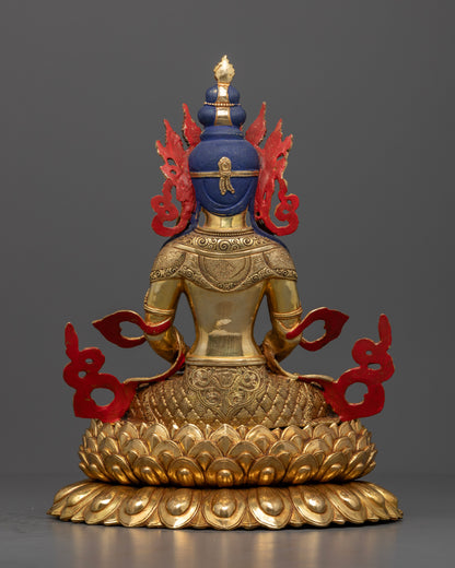 The Amitayus statue’s upper body, highlighting the serene face, ornate crown, and jewel-encrusted nectar vessel, symbolizing spiritual vitality, clarity, and the blessings of a long life.
