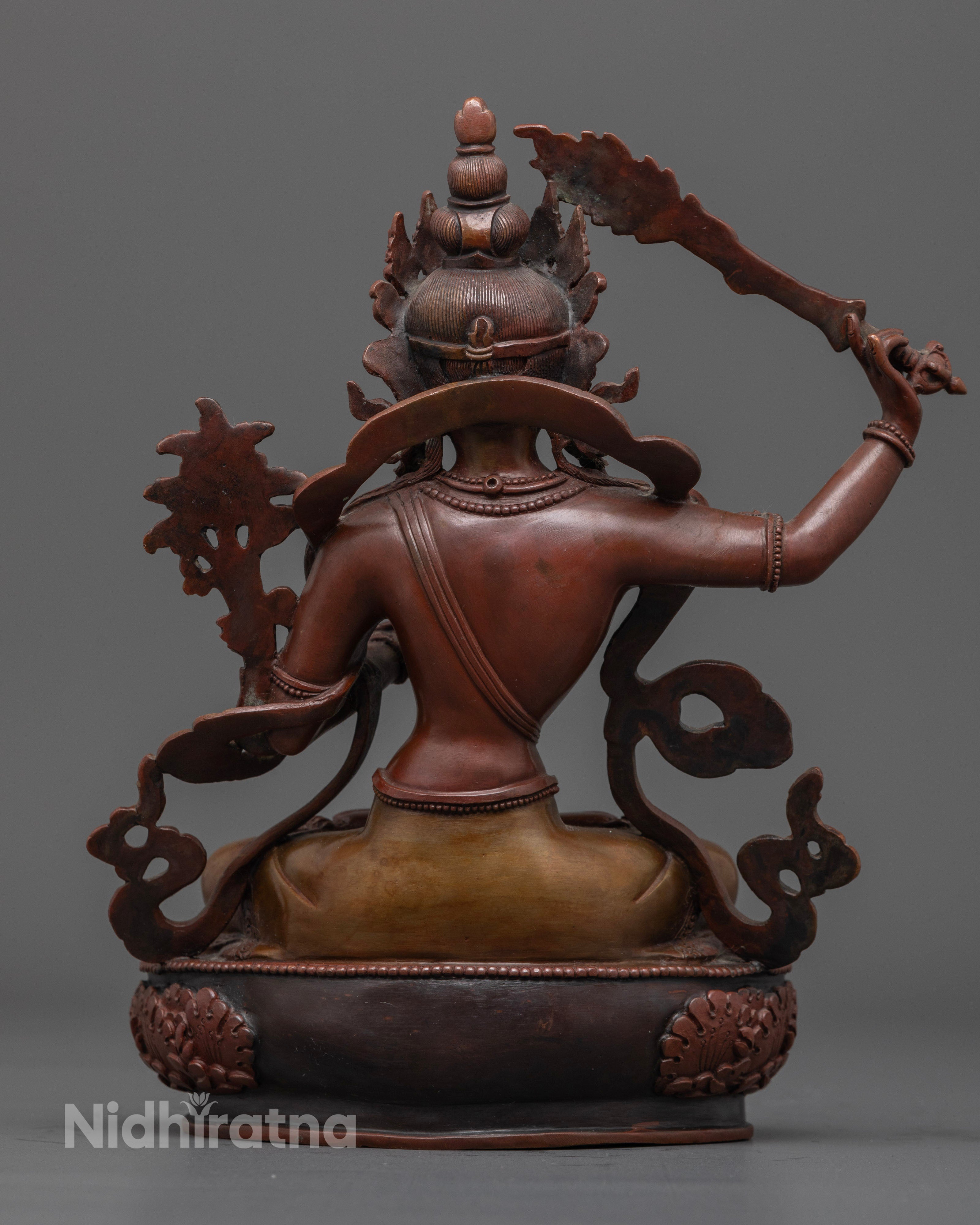 The handcrafted Manjushri statue, showcasing vibrant details, elegant oxidized finish, and powerful symbols of wisdom and spiritual clarity.