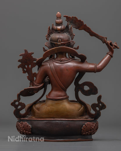The handcrafted Manjushri statue, showcasing vibrant details, elegant oxidized finish, and powerful symbols of wisdom and spiritual clarity.