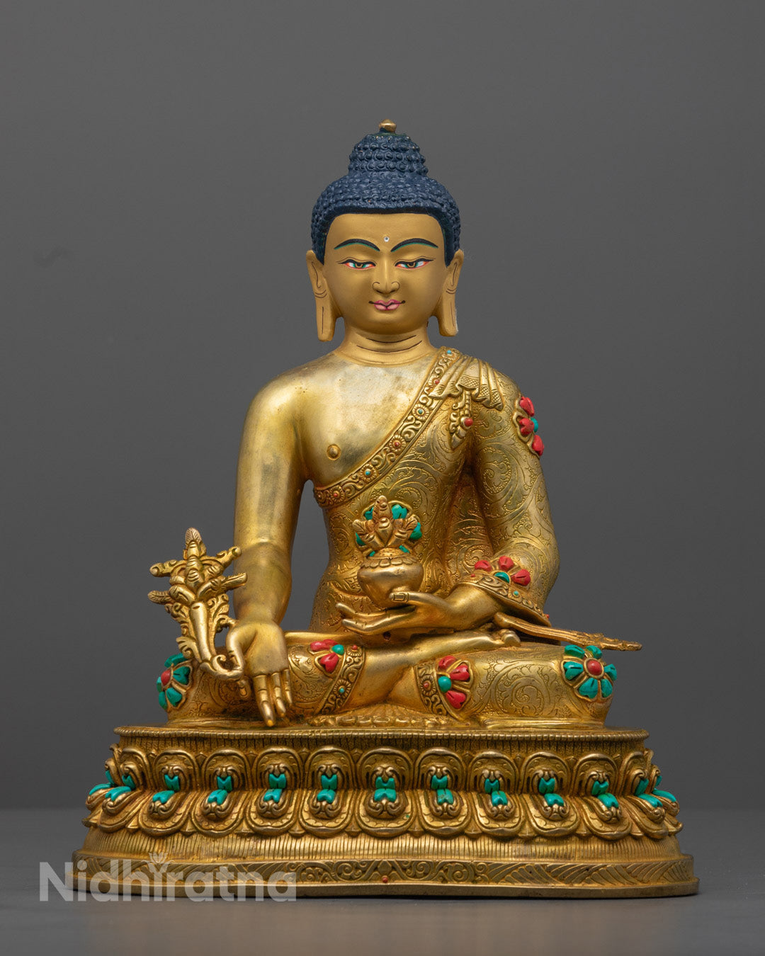 The stunning Medicine Buddha Statue, handcrafted in 24K gold-gilded copper, symbolizing healing, purity, and enlightenment