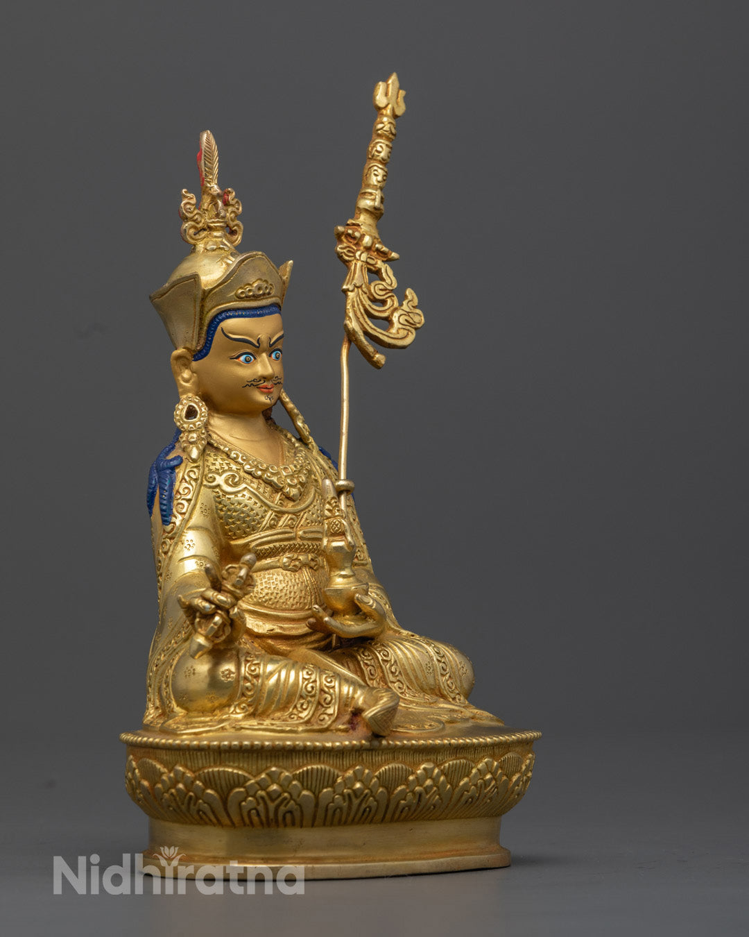 This 24.5cm Guru Rinpoche statue, meticulously crafted with intricate carvings, features a gold-painted face, representing compassion and protection for devotees.
