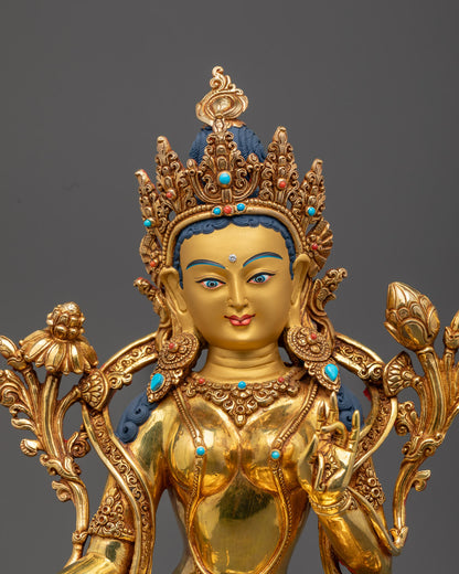 Tibetan Buddhist Green Tara statue adorned with semi-precious stones and vibrant acrylic colors