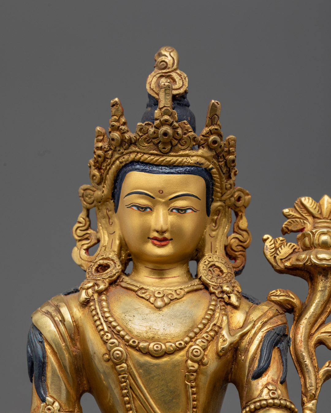 Tibetan Chenrezig statue featuring fire gold-gilded copper body and rich acrylic colors