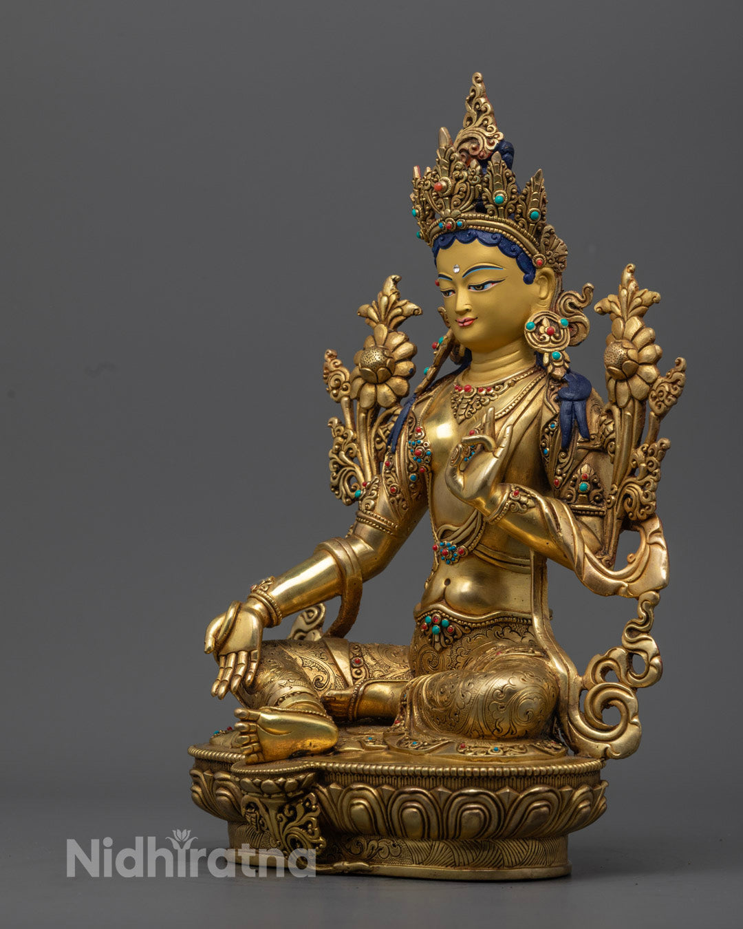 Gold fire gilded Green Tara statue with intricate hand-carved details, offering guidance and protection on your spiritual journey.