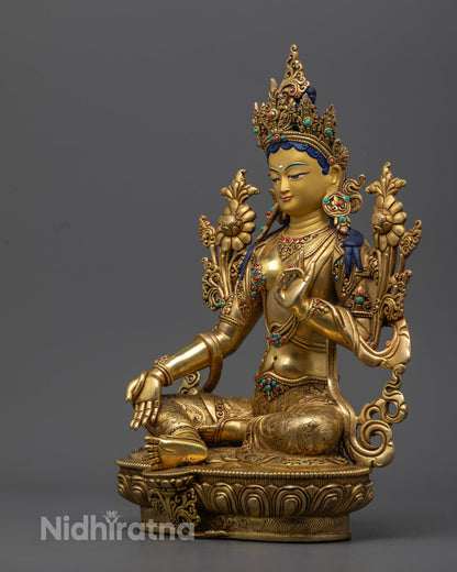 Gold fire gilded Green Tara statue with intricate hand-carved details, offering guidance and protection on your spiritual journey.