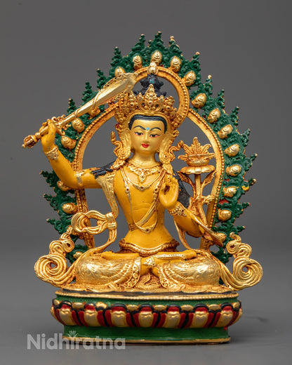 Tibetan Manjushri statue with gold-plated face seated on lotus throne symbol of wisdom and clarity
