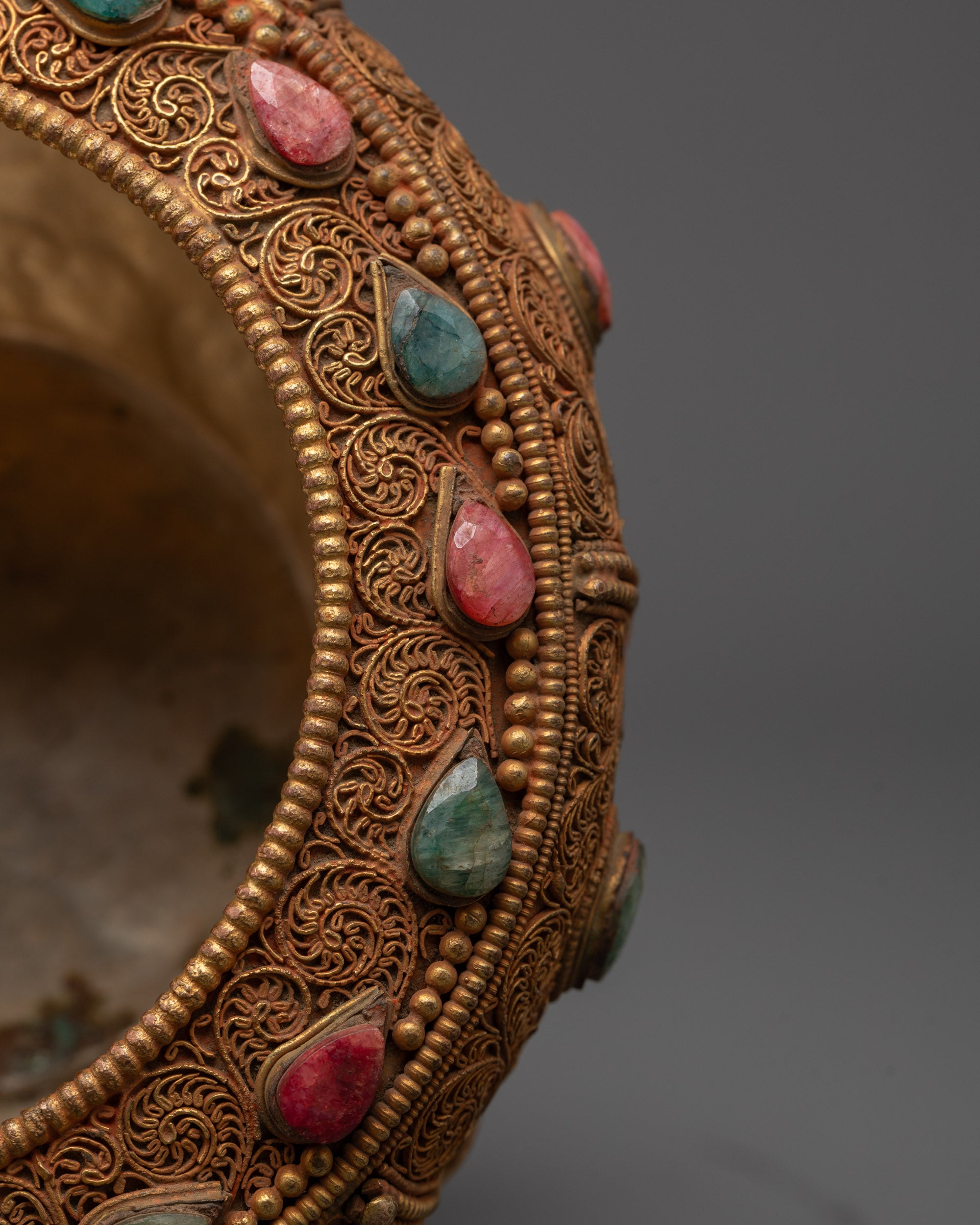 Top-down view of Dhirpur Rice Pot revealing gold-plated finish and symbolic designs