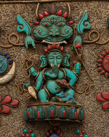Top-down view of Ganesh wall hanging highlighting intricate copperwork and semi-precious stones