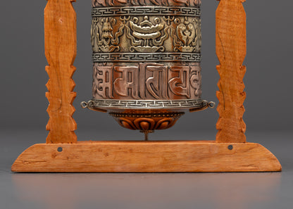 Top-down view of handcrafted Auspicious Prayer Wheel in shrine setting with spiritual glow
