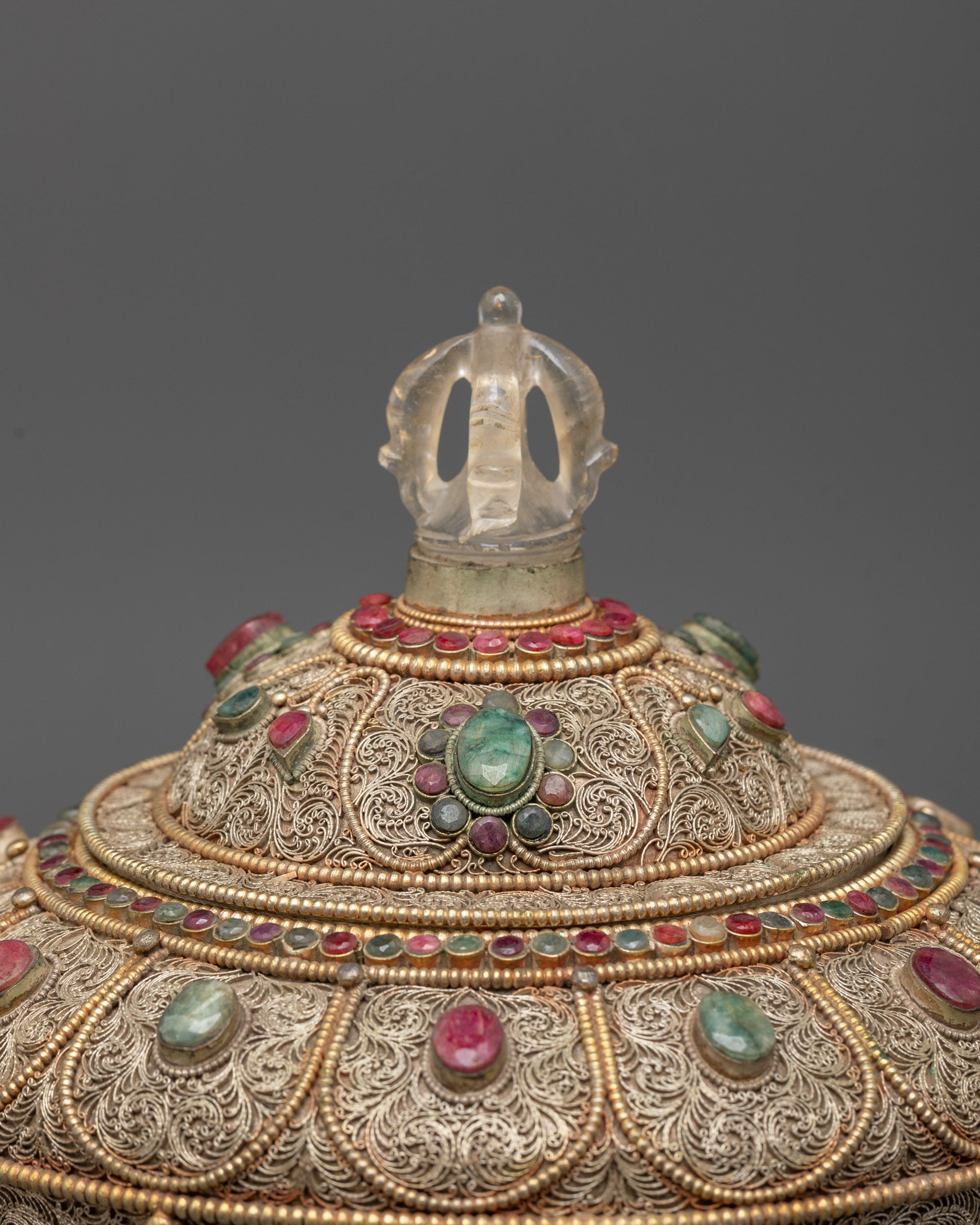 Top view highlighting crystal lid and ornate silver filigree work on Buddhist rice pot
