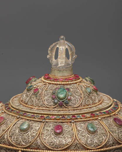 Top view highlighting crystal lid and ornate silver filigree work on Buddhist rice pot
