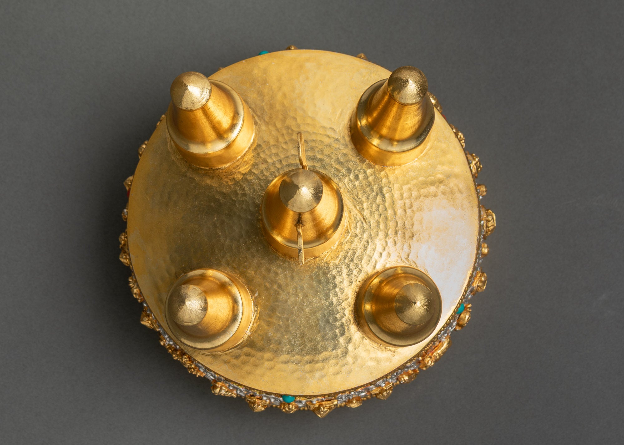 Top view of Kusum Mandala showing floral motifs, semi-precious stones, and silver finish