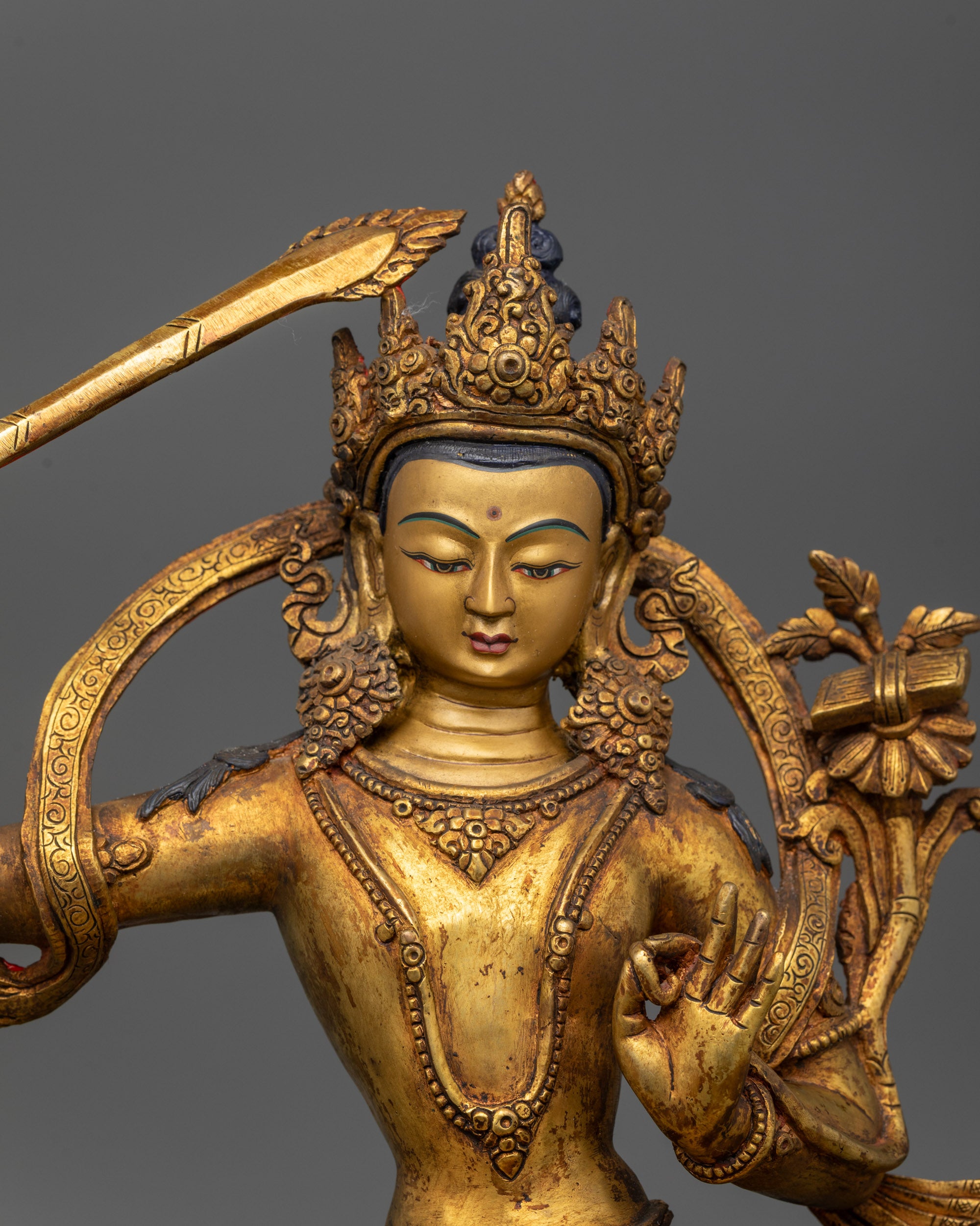 Top view of Manjushri showing double-edged sword and utpala flower
