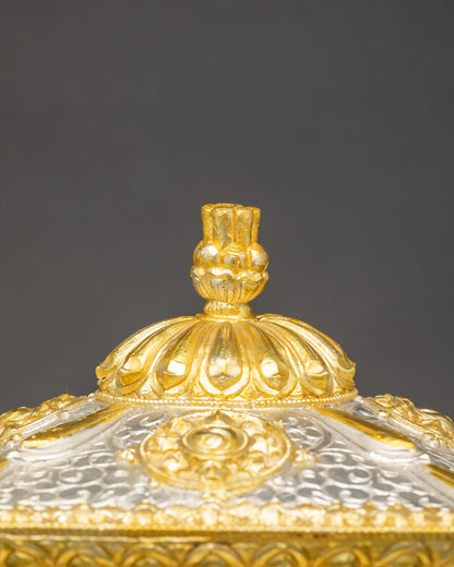 Top view of handcrafted Buddhist treasure box showing gold-silver plated details