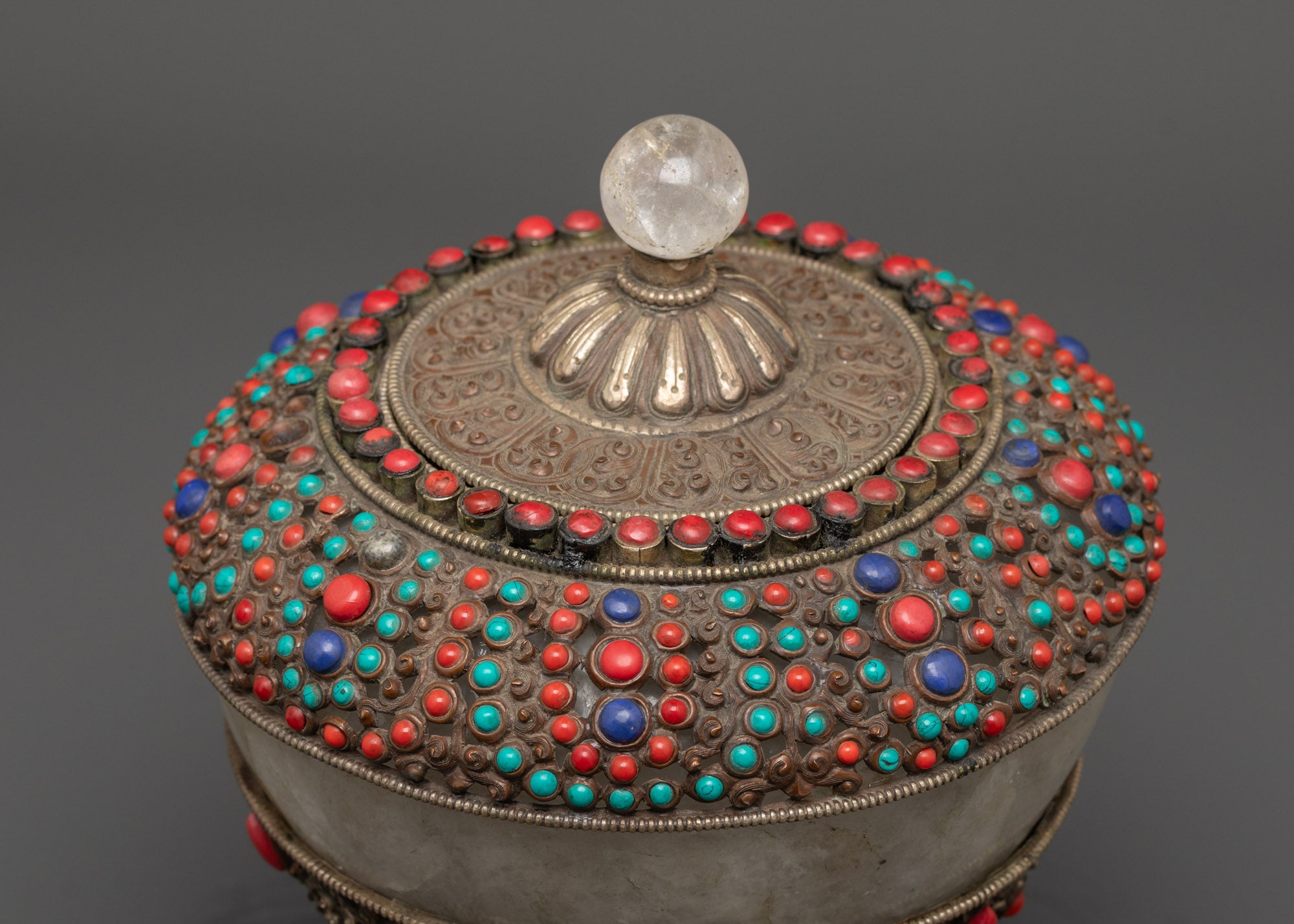 Top view of traditional Nepali Dhupur Rice Pot with ornate patterns and decorative gemstones
