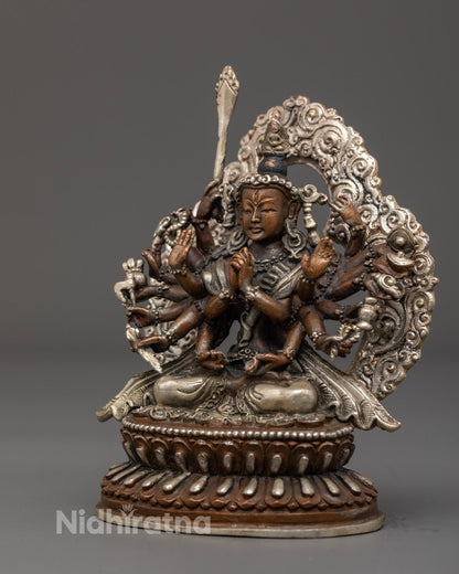 Traditional Chundi statue crafted by Nepalese artisans, featuring vibrant acrylic colors and silver finish, symbolizing feminine divine power.