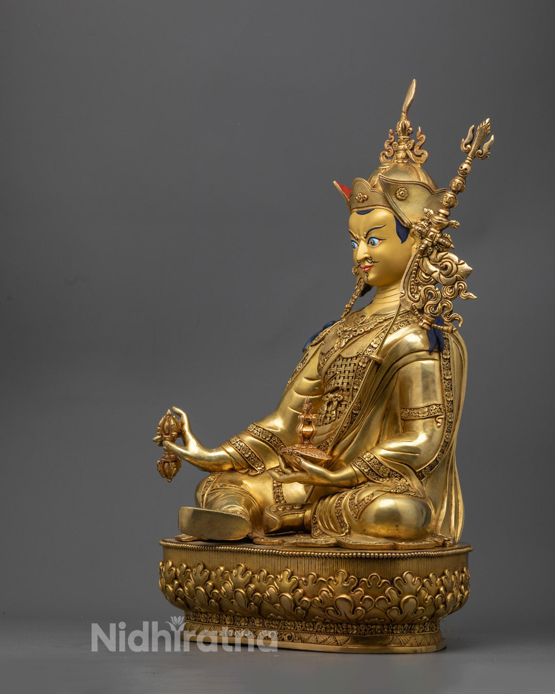 Traditional Nepalese Guru Rinpoche Statue with hollow chamber for auspicious mantra, painted with bright acrylic colors.