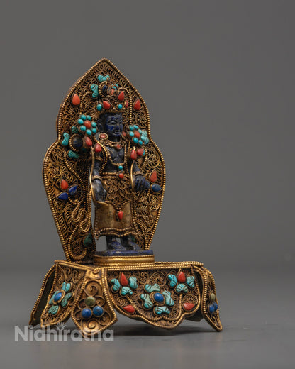 Traditional Nepalese Padmapani statue made from blue stones, symbolizing compassion and spiritual protection